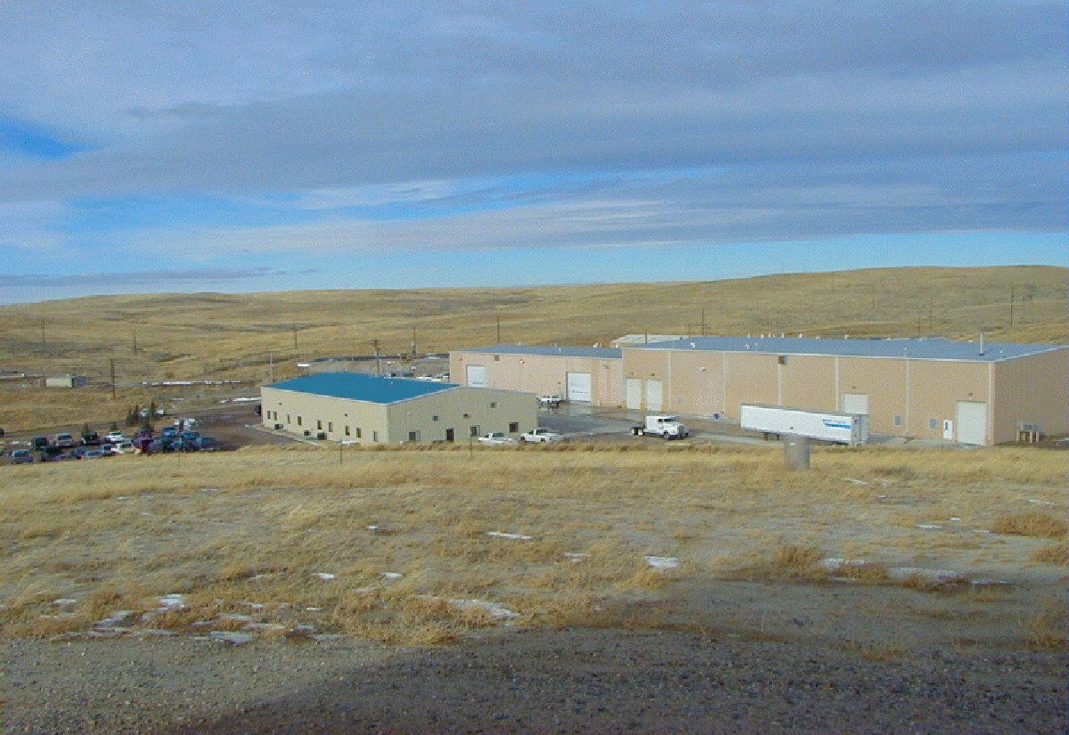 Central processing plant buildings at a uranium in-situ recovery site on open grassland