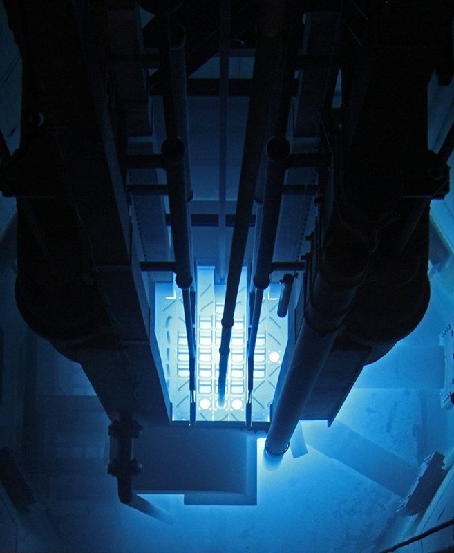 Blue Cherenkov glow surrounding the core of the UMass Lowell research reactor, seen from above through the pool water
